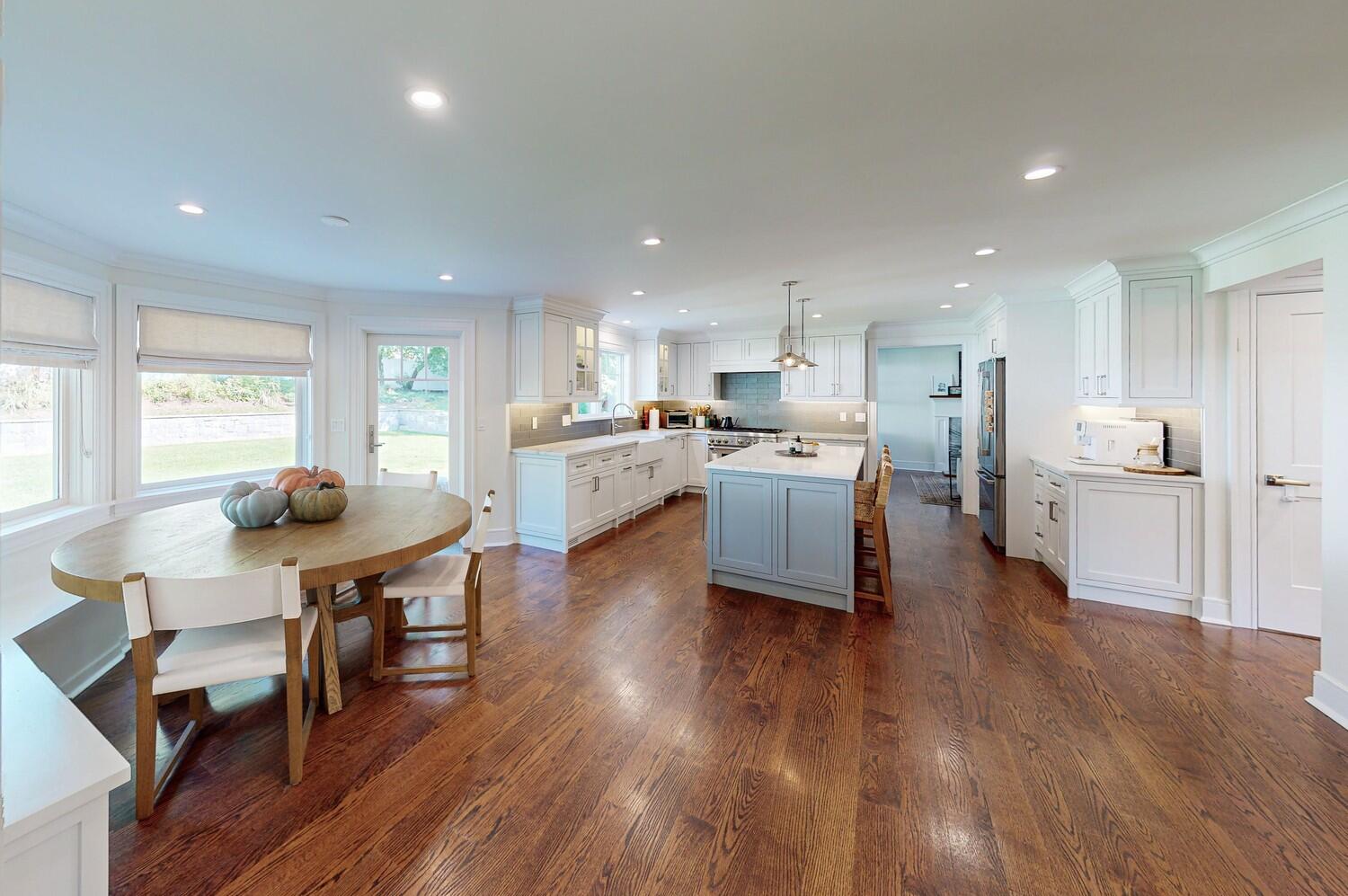 2 Hollow Tree Ridge Road Darien, CT 06820 - Photo 13 of 40 a living room with stainless steel appliances kitchen island granite countertop furniture wooden floor and a view of kitchen