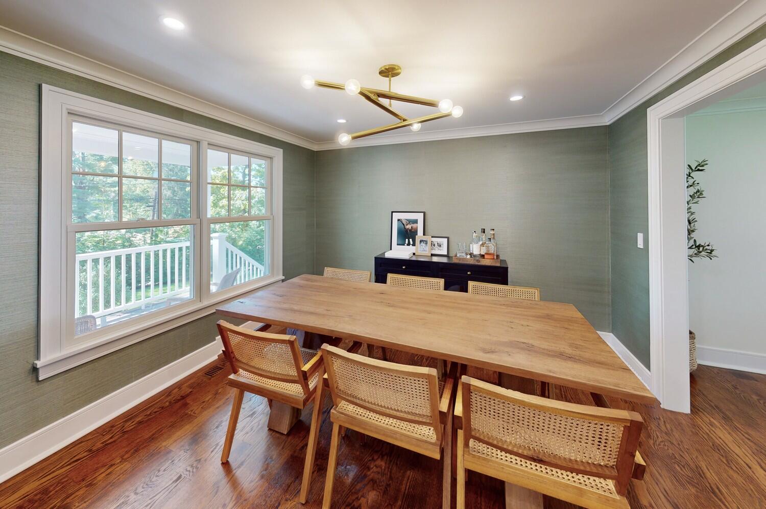 2 Hollow Tree Ridge Road Darien, CT 06820 - Photo 17 of 40 a dining room with a wooden table and chairs