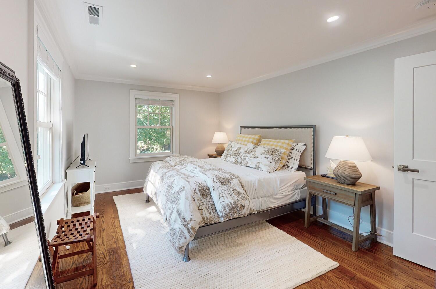 2 Hollow Tree Ridge Road Darien, CT 06820 - Photo 30 of 40 a bedroom with a bed a rug and wooden floor