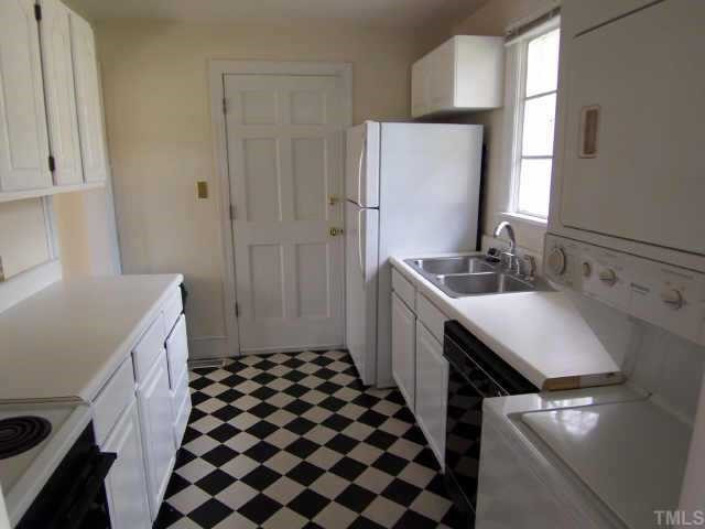 712 East Whitaker Mill Road Raleigh, NC 27608 - Photo 3 of 12 View of kitchen from foyer with door leading to side steps by driveway. Other