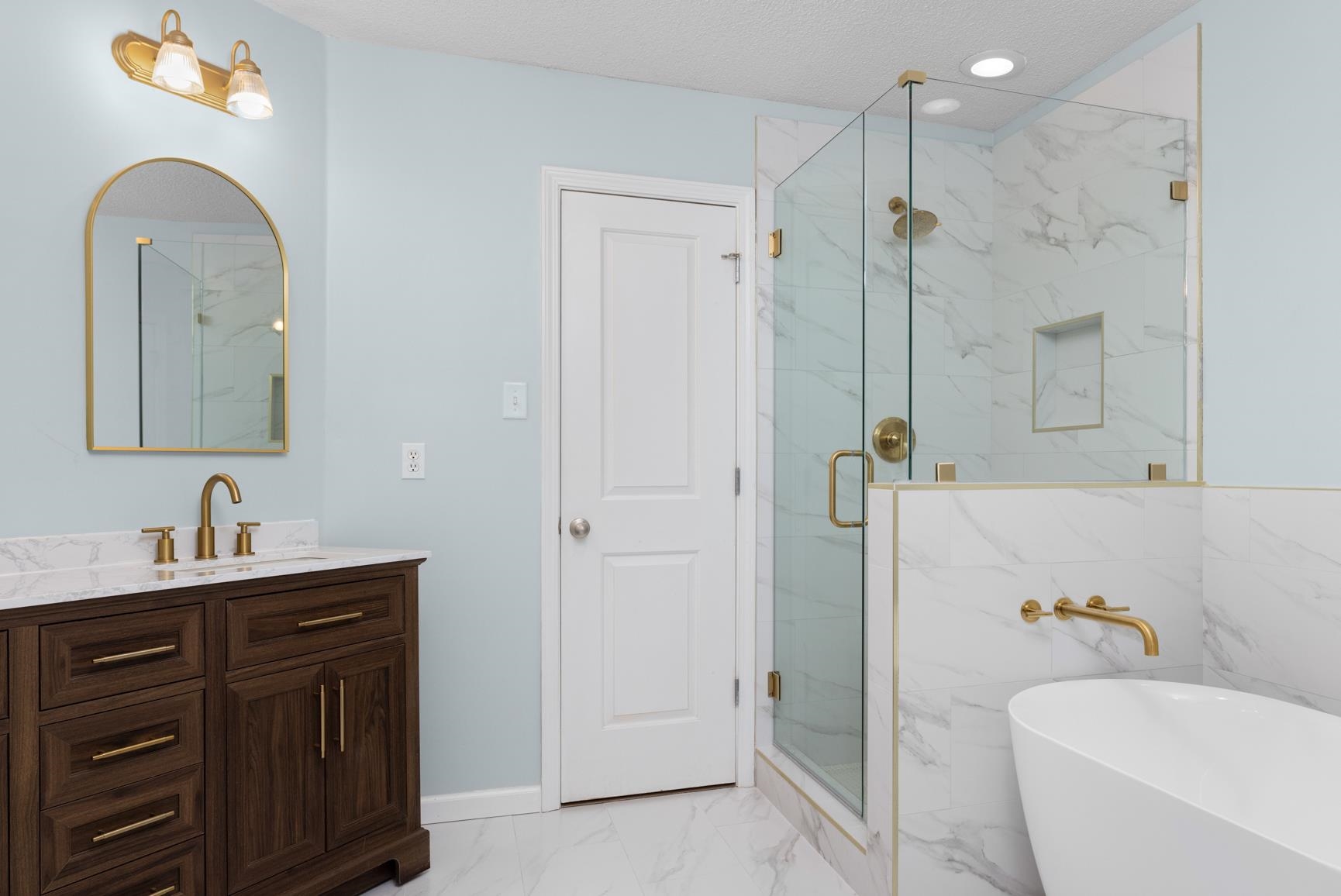 505 Terry Road Oakland, TN 38060 - Photo 26 of 40 Full bath featuring light marble finish floors, a soaking tub, a marble finish shower, vanity, and a textured ceiling