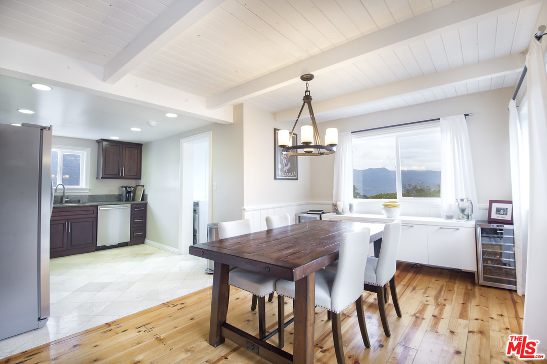 26258 Fairside Road Malibu, CA 90265 - Photo 12 of 46 a view of a dining room with furniture window and wooden floor