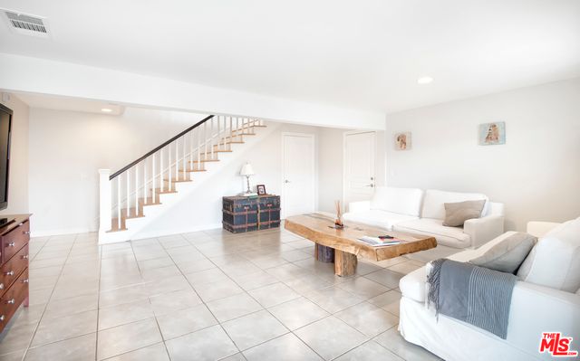 a bed room with a bed and a large window