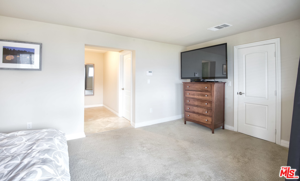 26258 Fairside Road Malibu, CA 90265 - Photo 18 of 46 a view of bedroom with a flat screen tv