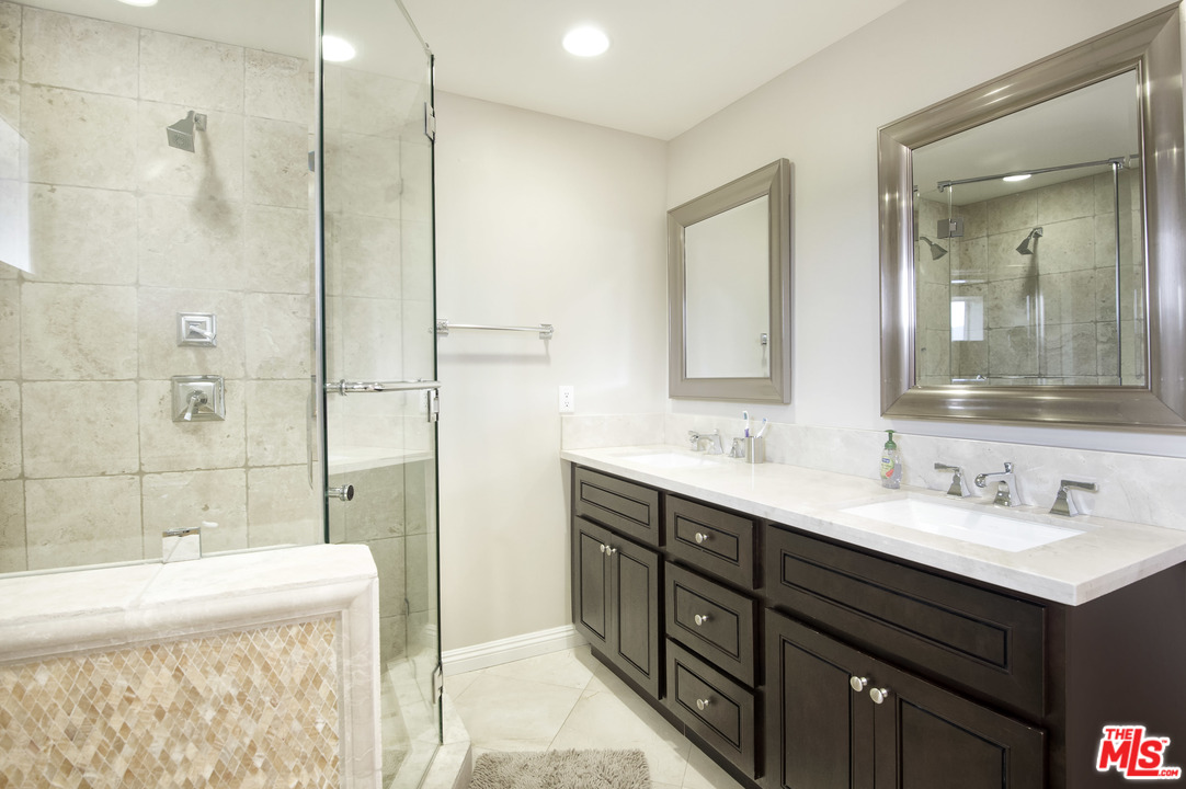 26258 Fairside Road Malibu, CA 90265 - Photo 19 of 46 a bathroom with a double vanity sink mirror and shower
