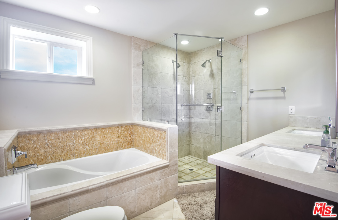 26258 Fairside Road Malibu, CA 90265 - Photo 20 of 46 a bathroom with a bathtub and a sink