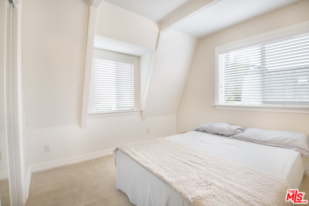 26258 Fairside Road Malibu, CA 90265 - Photo 24 of 46 a bedroom with a bed and a window