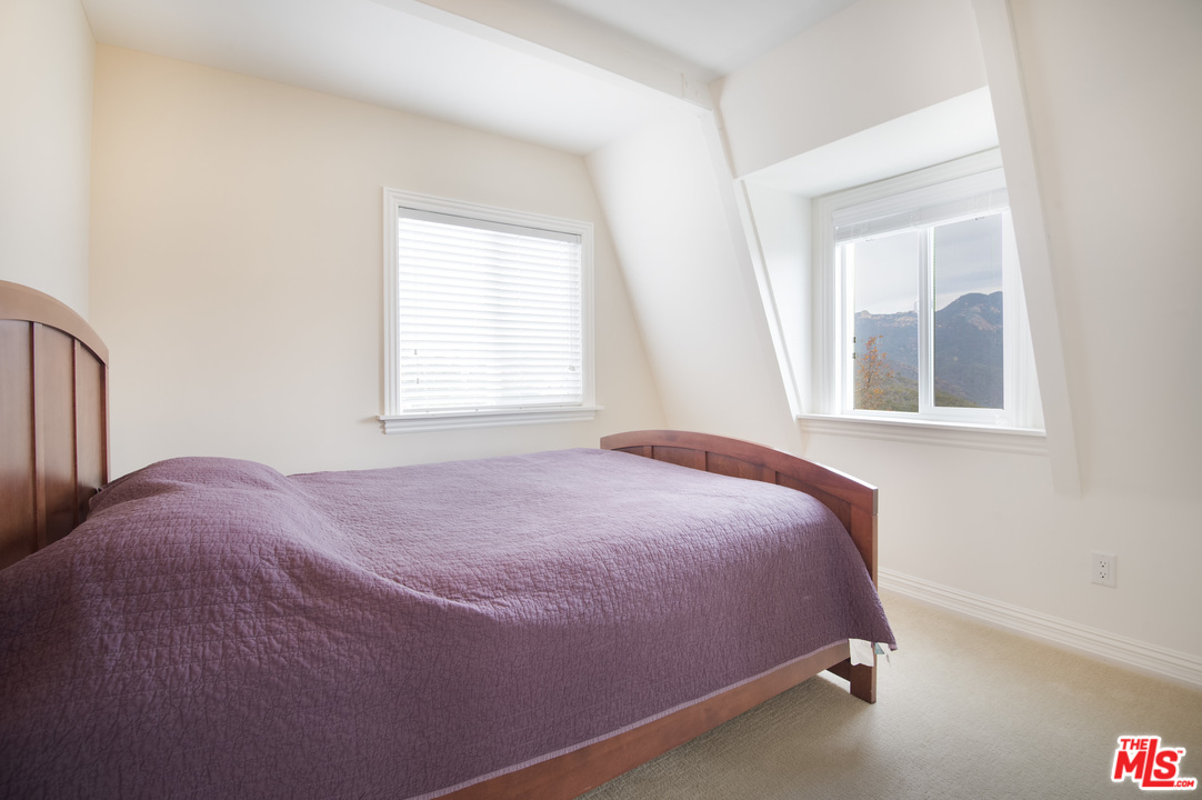 26258 Fairside Road Malibu, CA 90265 - Photo 27 of 46 a bed room with a bed and a window