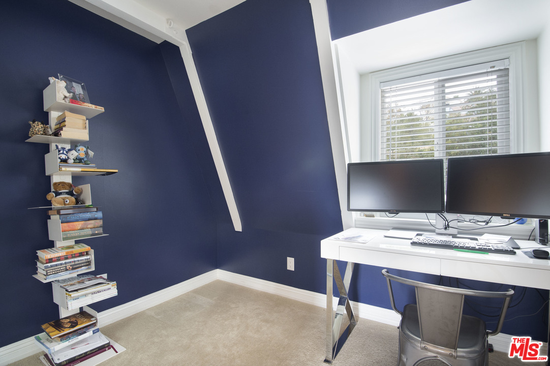 26258 Fairside Road Malibu, CA 90265 - Photo 31 of 46 a room with a window stairs and a chandelier