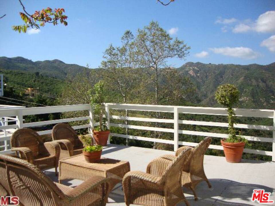 26258 Fairside Road Malibu, CA 90265 - Photo 37 of 46 a view of a chairs and table in patio