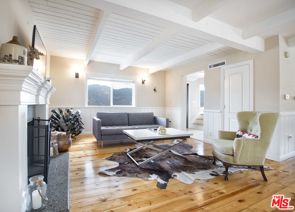 26258 Fairside Road Malibu, CA 90265 - Photo 7 of 46 a living room with furniture and wooden floor