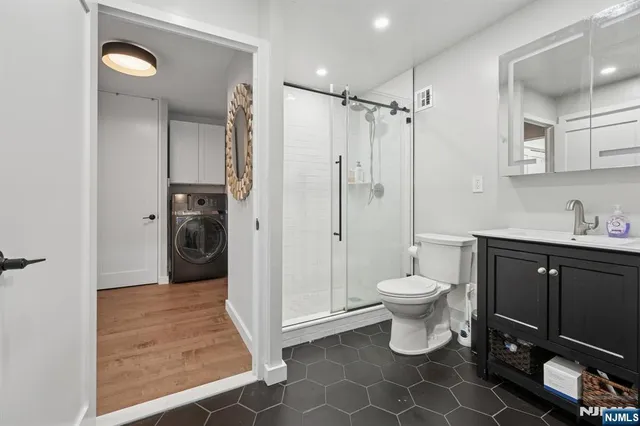 a bedroom with a bed couch and window