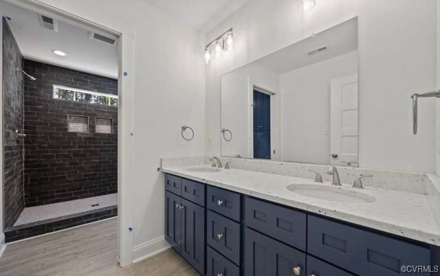 13985 Cross County Road Mineral, VA 23117 - Photo 18 of 27 a bathroom with double sink and a mirror