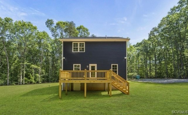 13985 Cross County Road Mineral, VA 23117 - Photo 2 of 27 a backyard of a house with table and chairs