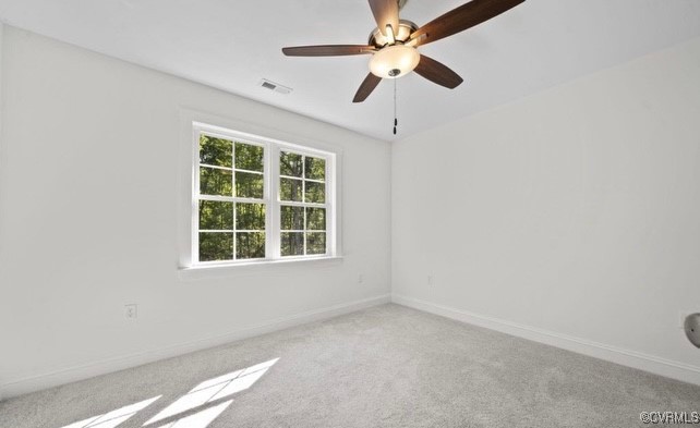 13985 Cross County Road Mineral, VA 23117 - Photo 23 of 27 an empty room with a window and a fan