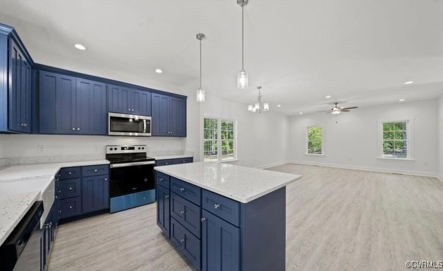 13985 Cross County Road Mineral, VA 23117 - Photo 6 of 27 a kitchen with stainless steel appliances granite countertop a sink a stove and a wooden floors