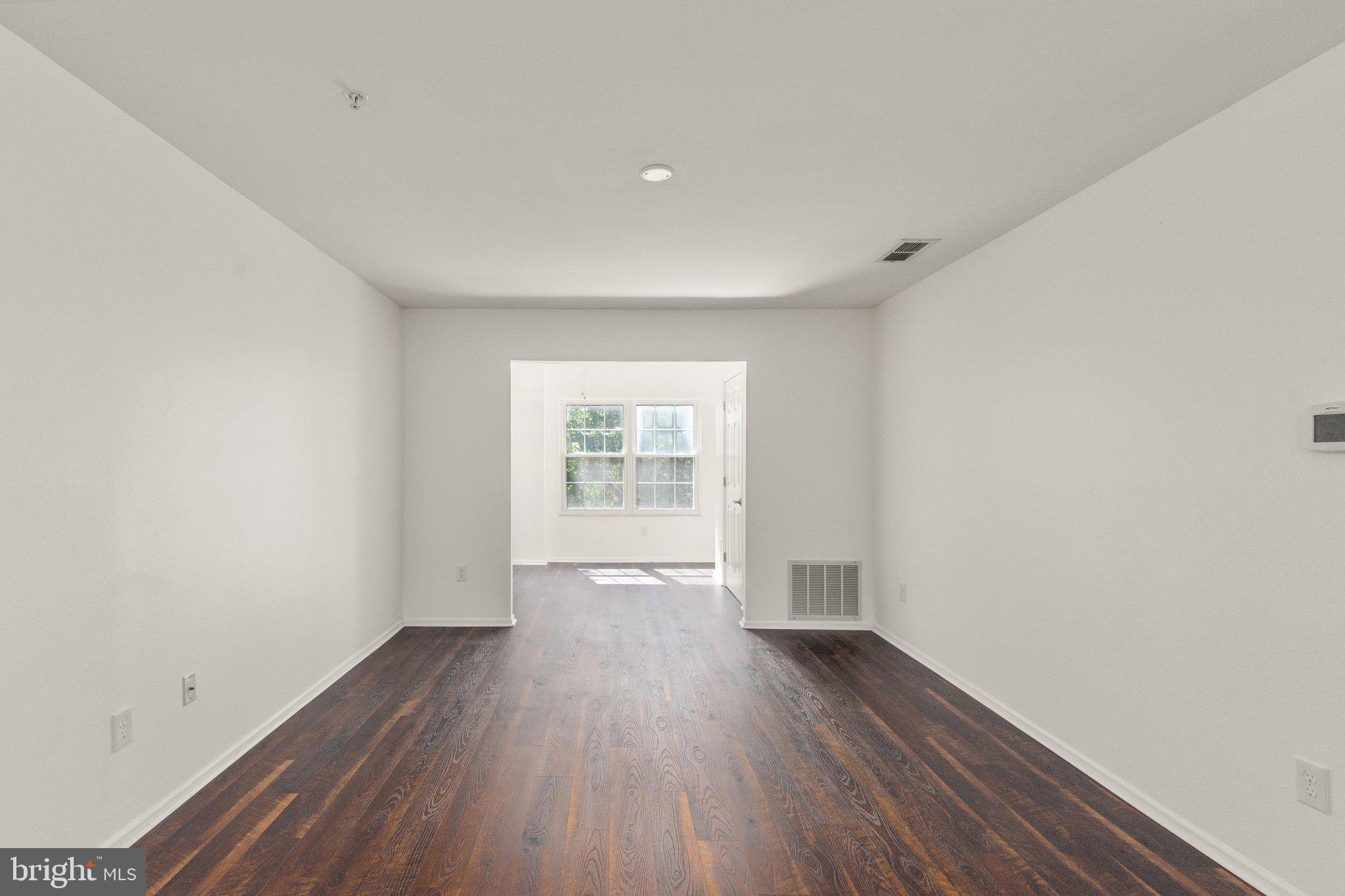 608 Churchill Road, Unit L Bel Air, MD 21014 - Photo 6 of 23 Bright Spacious Living Room leads to Den