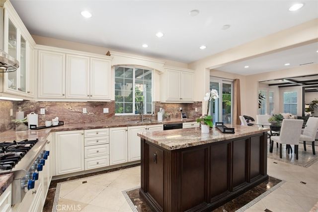 a kitchen with counter top space cabinets and stainless steel appliances