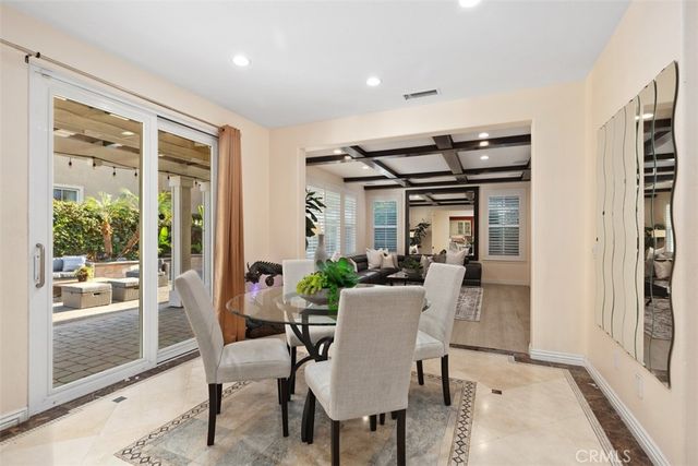 a bedroom with furniture and a flat screen tv