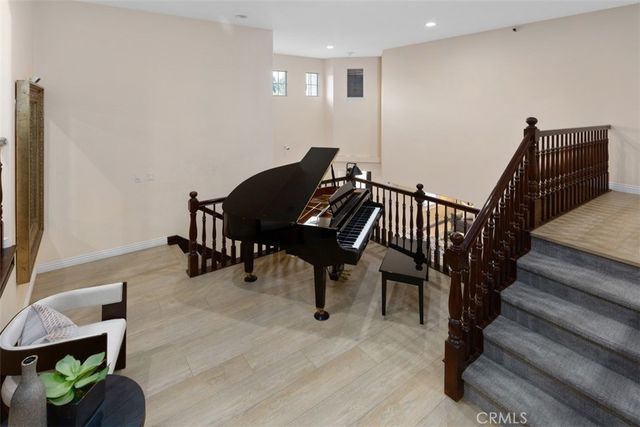 a spacious bedroom with a bed and a couch