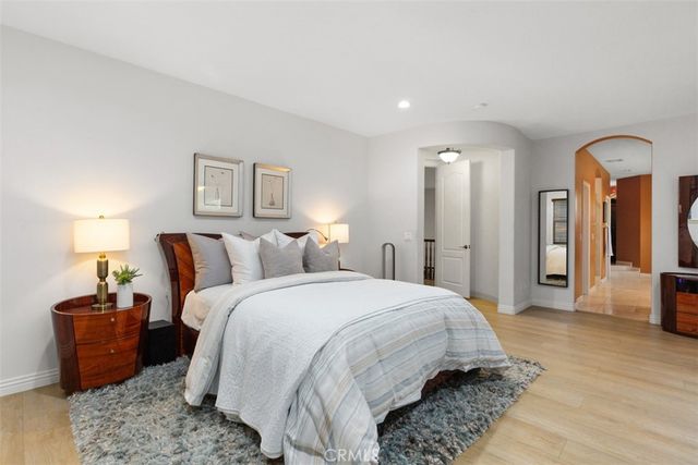 a living room with furniture a piano and a window