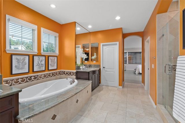 a living room with furniture and a book shelf