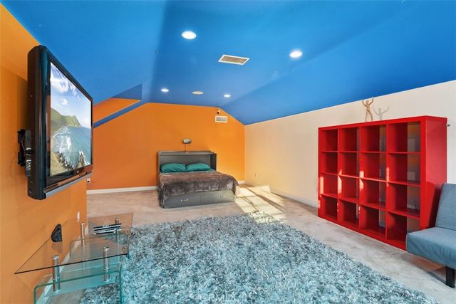 a room with gym equipment and windows