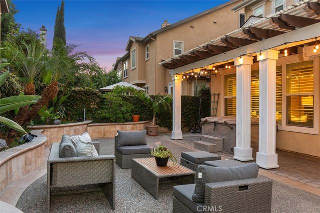an aerial view of a house with a palm tree