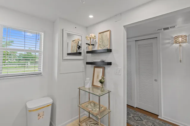 a kitchen with appliances a sink and cabinets
