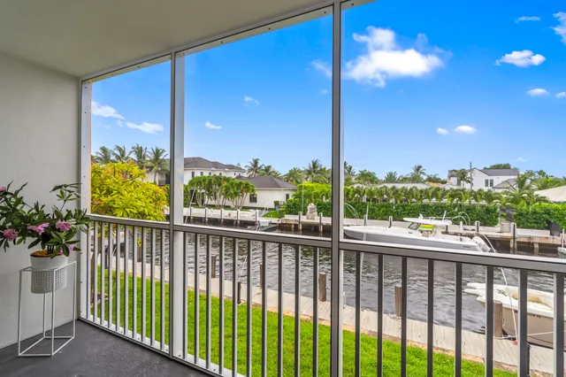 a view of two chairs in the balcony