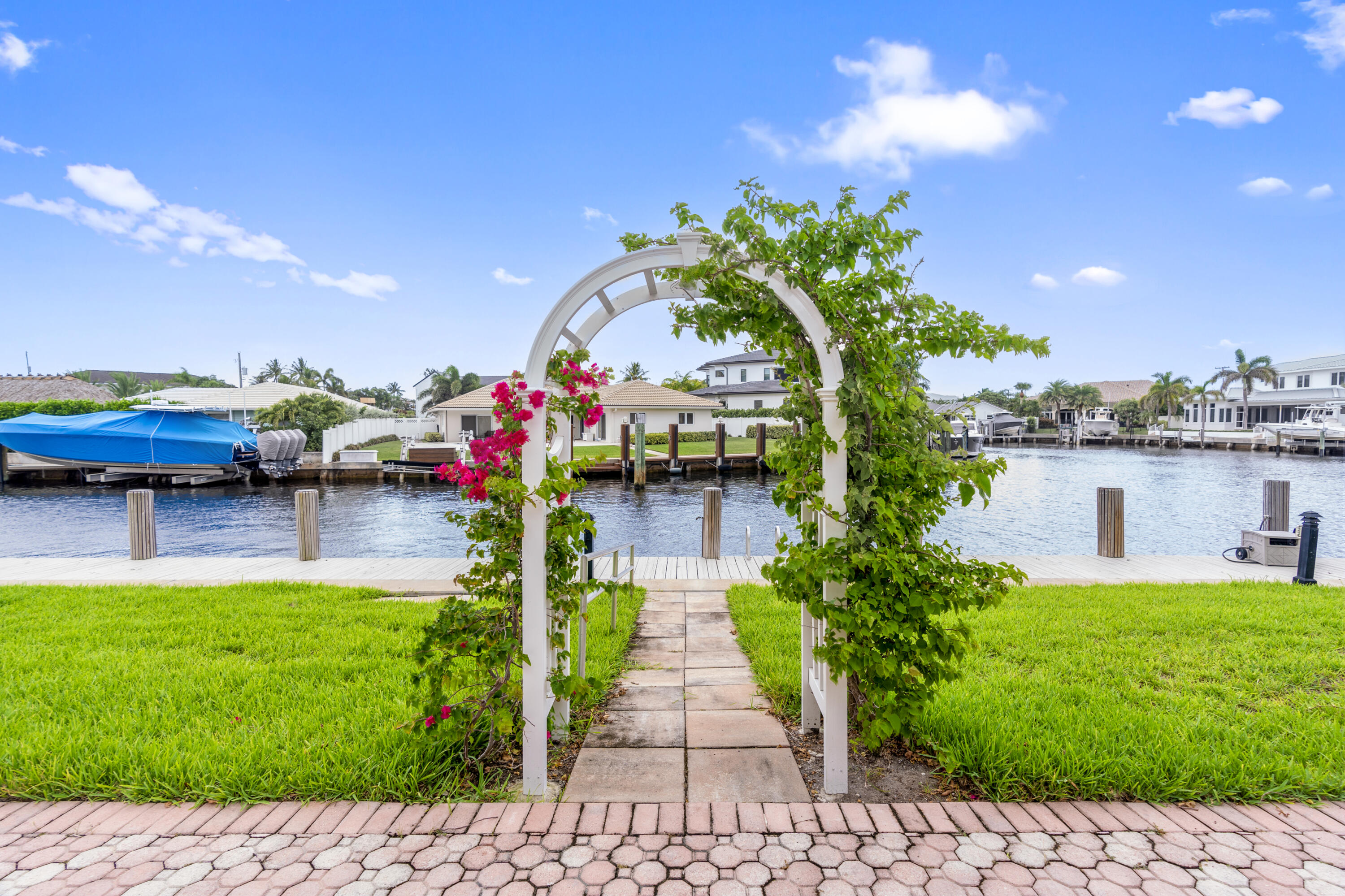 750 Northeast Spanish River Boulevard, Unit 2040 Boca Raton, FL 33431 - Photo 32 of 40 a house with garden in front of it