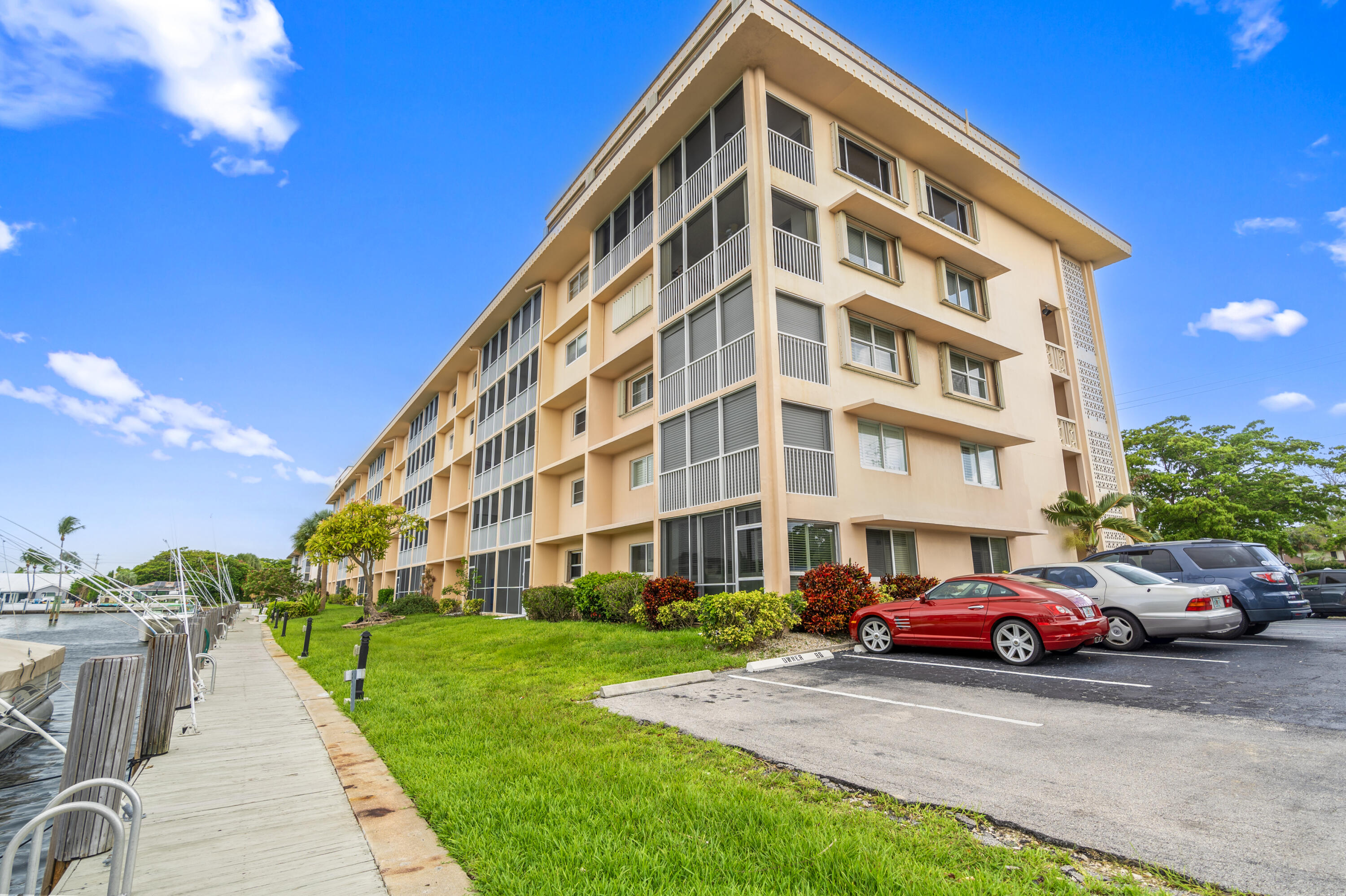 750 Northeast Spanish River Boulevard, Unit 2040 Boca Raton, FL 33431 - Photo 37 of 40 a view of a building with a yard