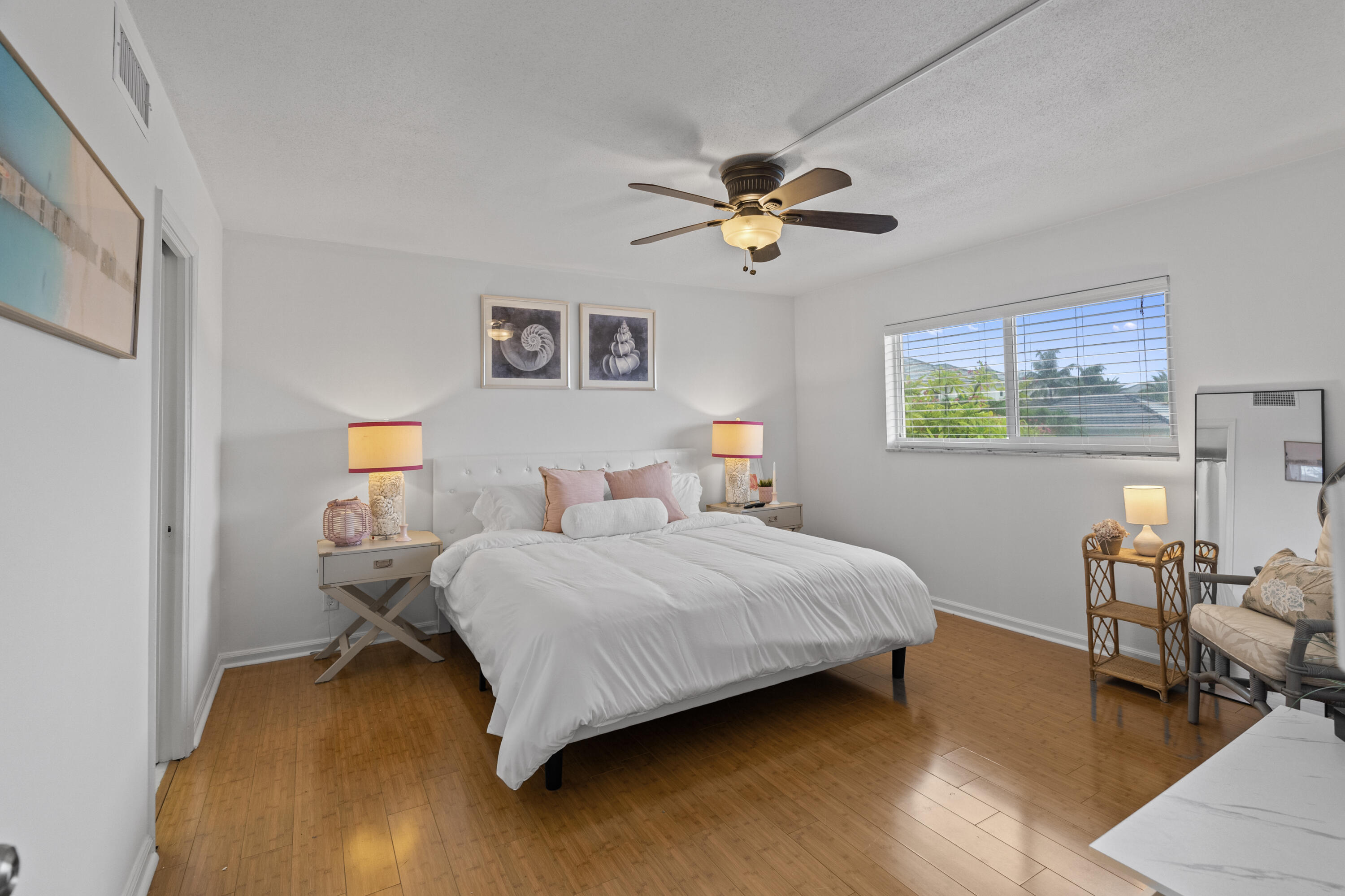 750 Northeast Spanish River Boulevard, Unit 2040 Boca Raton, FL 33431 - Photo 7 of 40 a bedroom with a bed furniture and a window