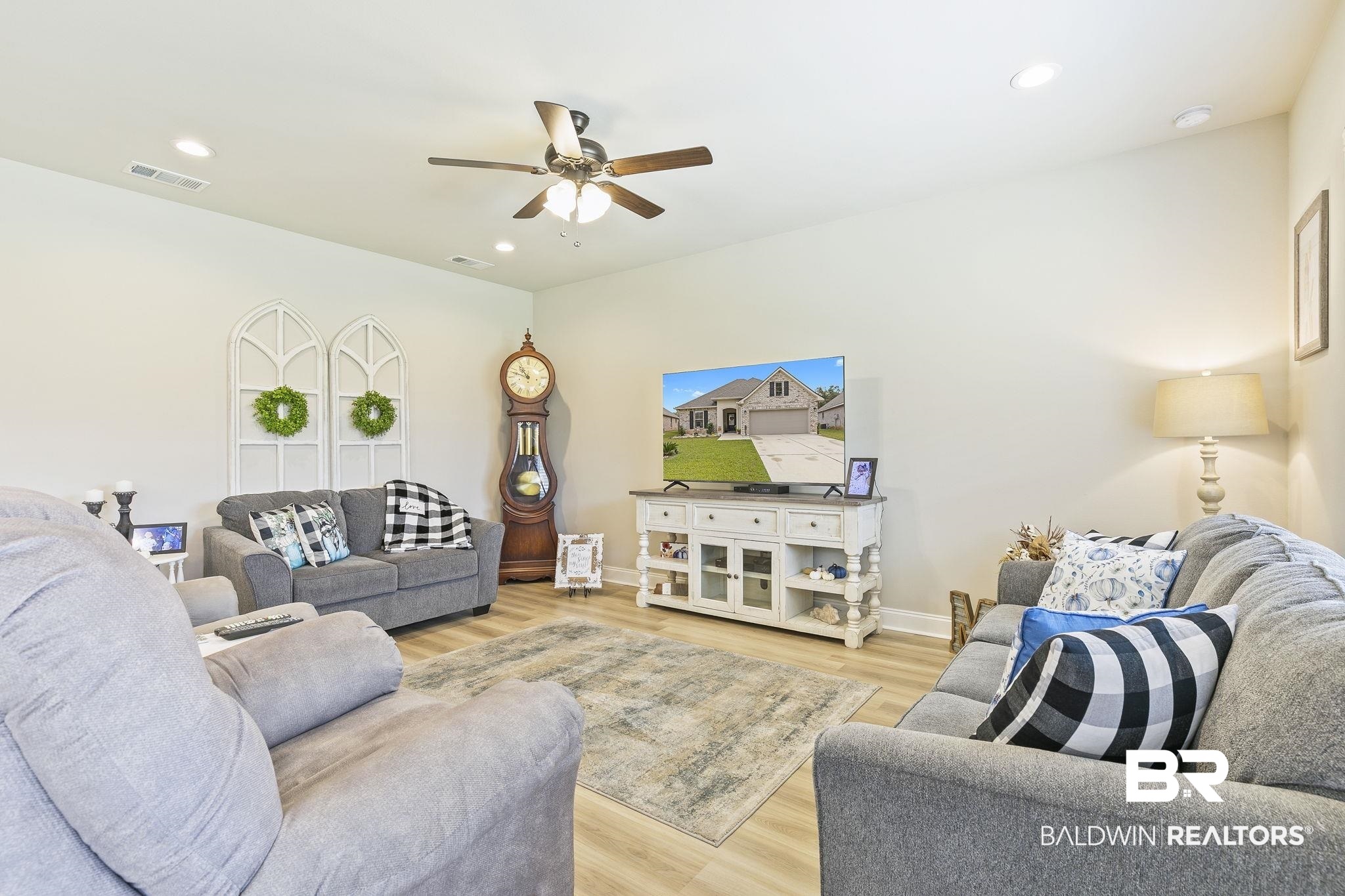 910 Gibson Court Foley, AL 36535 - Photo 11 of 66 Open concept with lots of light and views of the backyard and the lake.