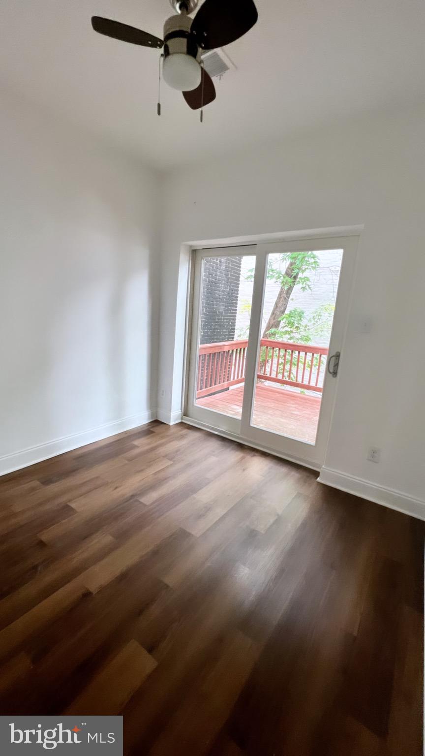 1345 1st Street Northwest, Unit 2 Washington, DC 20001 - Photo 15 of 19 a view of an empty room with wooden floor and a window