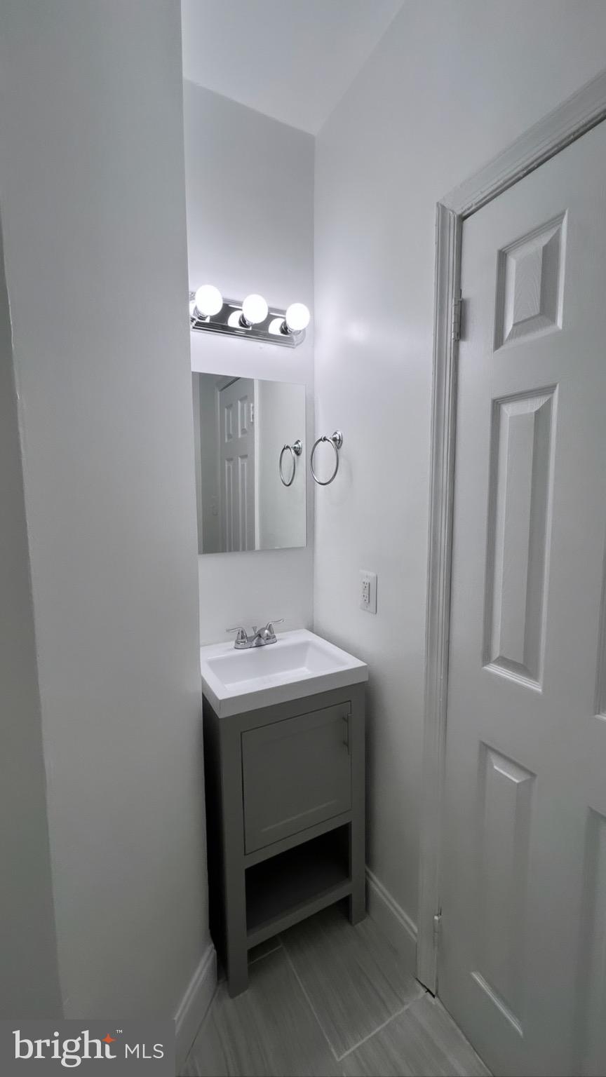 1345 1st Street Northwest, Unit 2 Washington, DC 20001 - Photo 18 of 19 a bathroom with a sink and a mirror