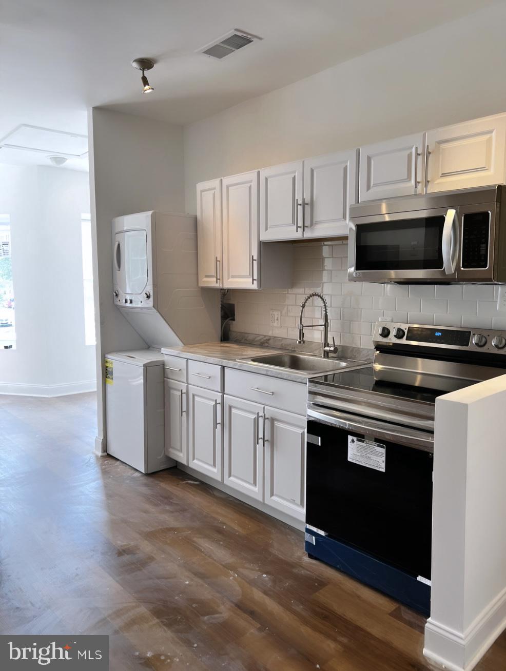1345 1st Street Northwest, Unit 2 Washington, DC 20001 - Photo 19 of 19 a kitchen with stainless steel appliances granite countertop a sink and cabinets