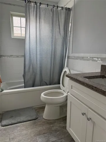 a bathroom with a toilet a sink and bathtub