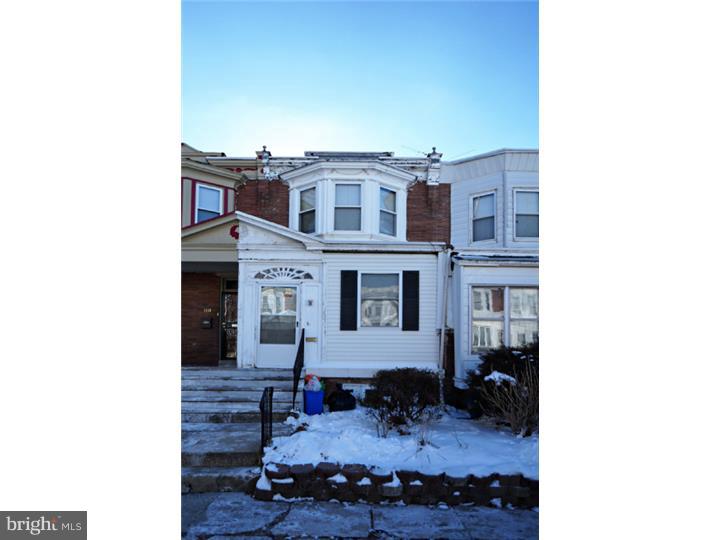 6016 West Thompson Street Philadelphia, PA 19151 - Photo 1 of 17 a view of a house with a backyard and sitting area