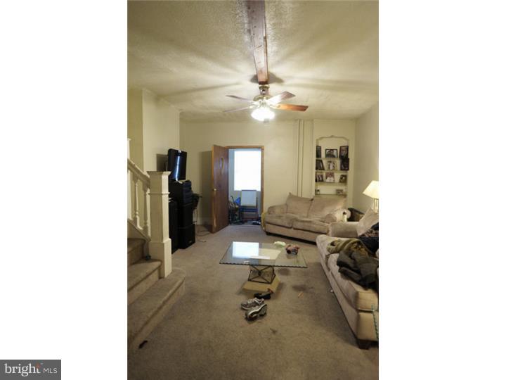 6016 West Thompson Street Philadelphia, PA 19151 - Photo 4 of 17 a view of a room with gym equipment
