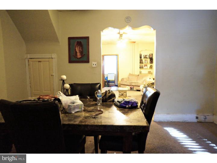 6016 West Thompson Street Philadelphia, PA 19151 - Photo 5 of 17 a dining room with furniture and wooden floor