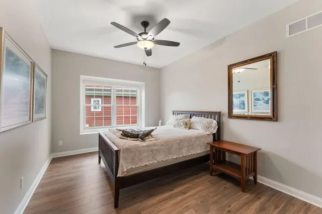 a bathroom with a sink toilet and mirror