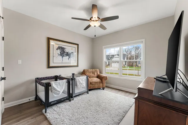 a view of livingroom with hardwood floor and stairs