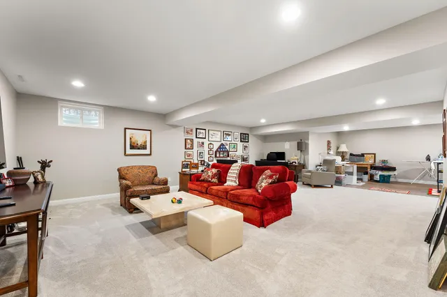a living room with lots of furniture and gym equipment