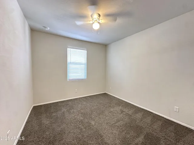 an empty room with a bathroom