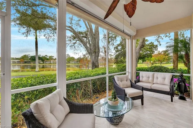 a balcony with furniture and garden view