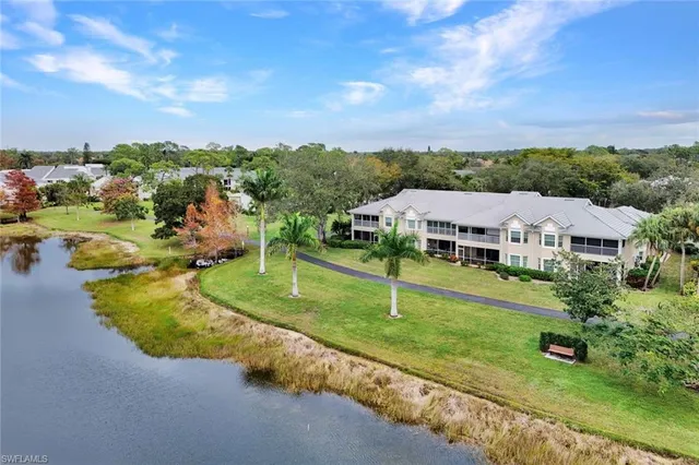 an aerial view of a house with garden space and street view