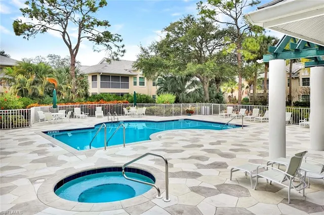a view of a swimming pool with a patio