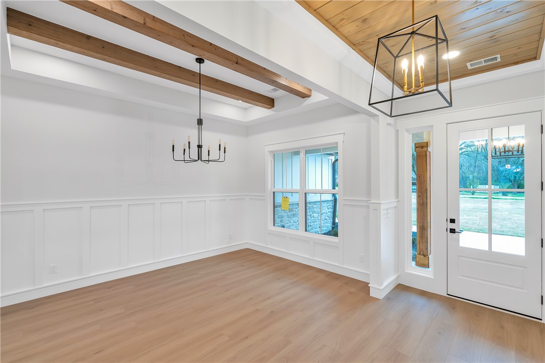 4554 Flat Rock Road Iva, SC 29655 - Photo 17 of 32 Exposed wood beams adorn the ceiling of this luminous entry, creating an inviting welcome.