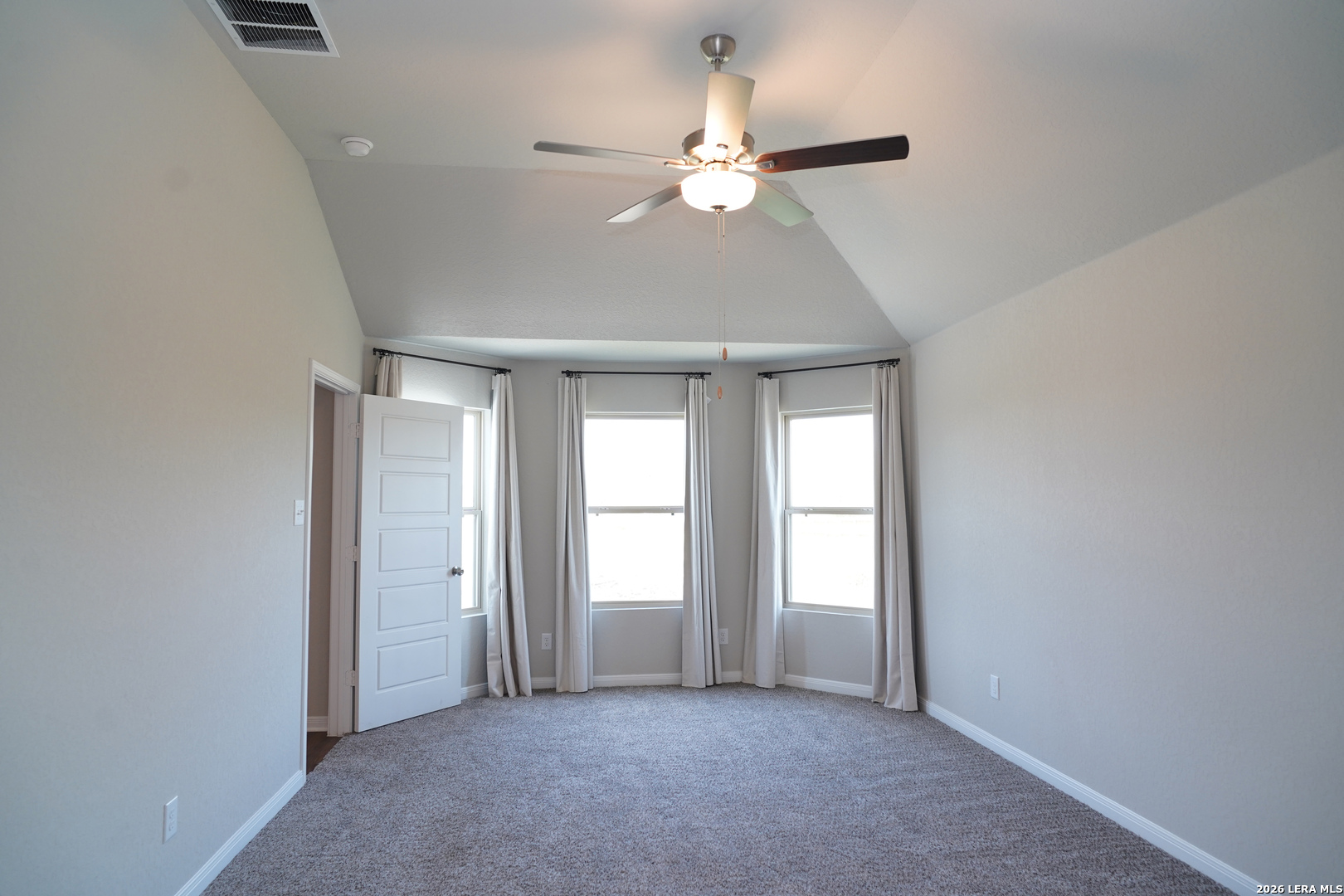20929 Pleasanton Road San Antonio, TX 78264 - Photo 34 of 51 an empty room with chandelier fan and windows